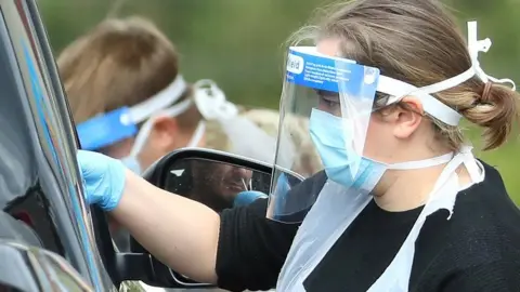 Getty Images Taking a swab at testing centre