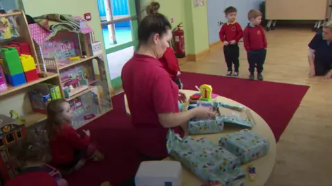 Children in Londonderry helping pack a shoebox