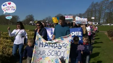 BBC Protesters march against plans to close a number of Northumberland schools