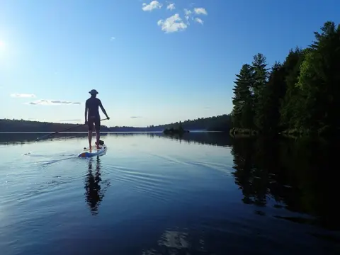 Anna Strzelecka Paddle boarder on a lake