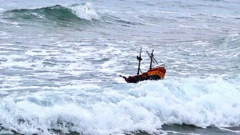 PA / Ferguson family Toy ship in sea