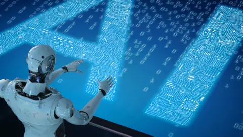 Getty Images Robot looking at AI sign