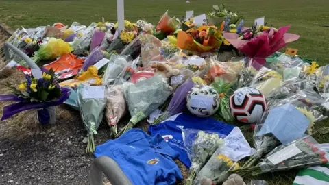 Floral tributes at pitch