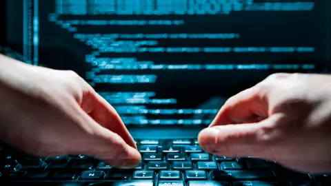 Getty Images Hands on a keyboard