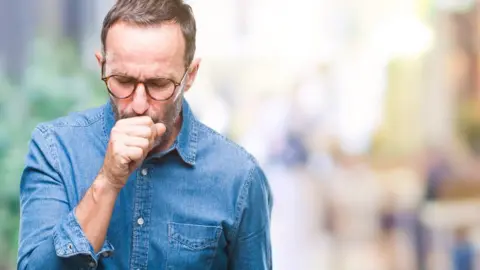 Getty Images Man coughing