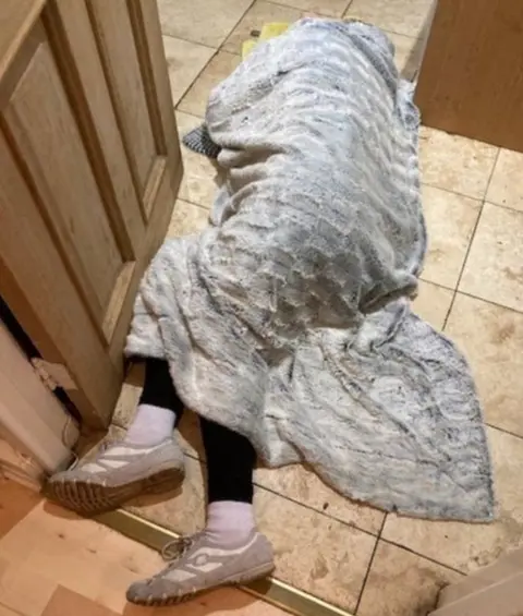 Robert Ewing Lillian Briggs on kitchen floor