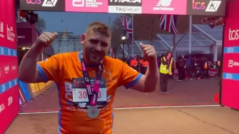 Tom Durnin at London Marathon finish line