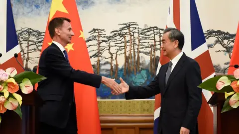 AFP Britain's Foreign Secretary Jeremy Hunt (L) shakes hands with China's Foreign Minister Wang Yi (R) after a press conference at the Diaoyutai State Guesthouse in Beijing on July 30, 2018