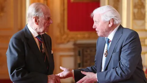 Getty Images Prince Philip talking to Sir David Attenborough