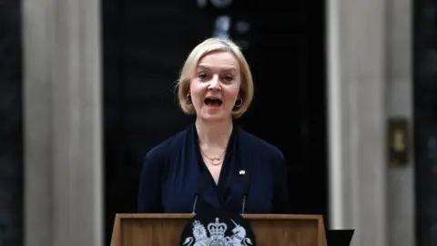 EPA-EFE/REX/Shutterstock Liz Truss delivering her resignation statement in Downing Street