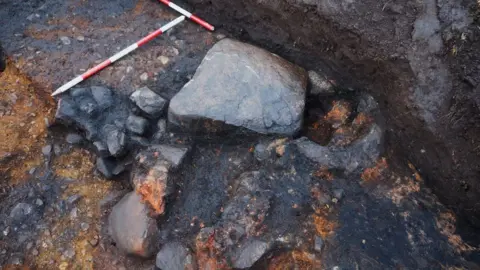 Scottish Water Smelting furnaces built against a large boulder