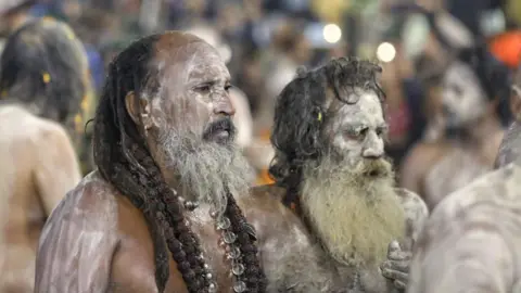 Ankit Srinivas Ash-smeared naked Hindu holy men seen after the bathing ritual