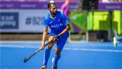 Getty Images Hardik Singh of India in action during the Australia v India, Men's Hockey, Gold Medal match at Birmingham University during the Birmingham 2022 Commonwealth Games on August 8, 2022, in Birmingham, England.
