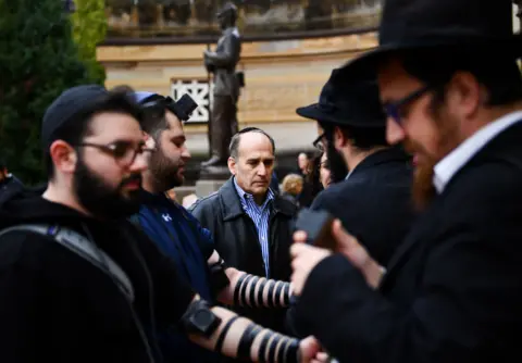 Getty Images A vigil is held at the Tree of Life synagogue in Pittsburgh, in memory of the 11 people who died