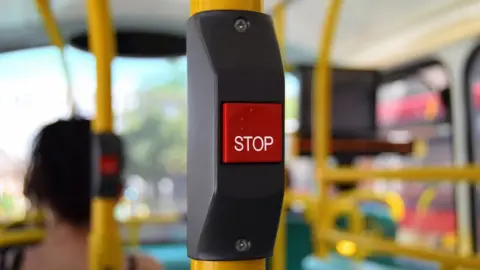 Getty Images Stop button on bus