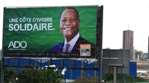 AFP Mr Ouattara's campaign billboard appeals for unity in Ivory Coast