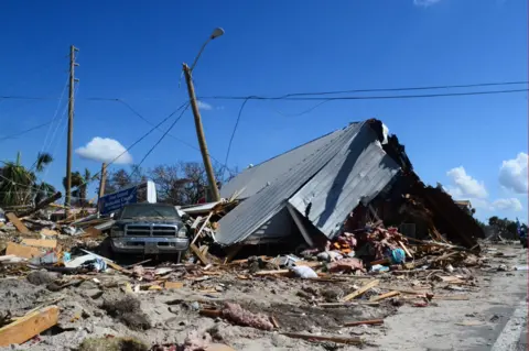 BBC A car in the wreckage