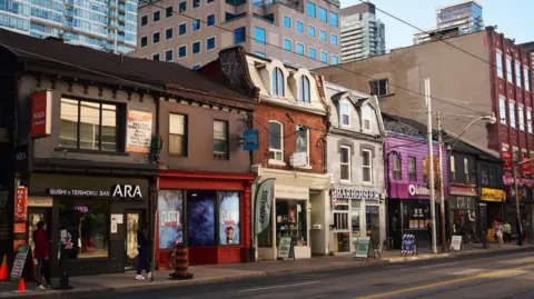 A view of the shopfront on Queen Street in Toronto