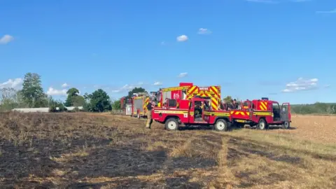 Horndean Fire Station Fire engines beside scorched grass