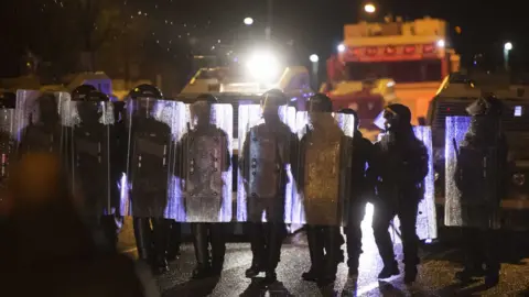 EPA Police are seen during clashes with nationalist youths on the Springfield Road in west Belfast, in Northern Ireland