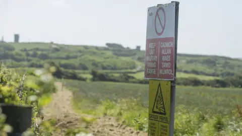 Wales News Service A warning sign at Castlemartin Range