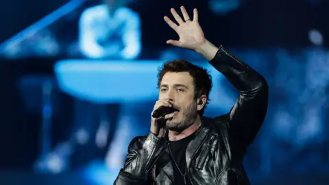 Getty Images Finland's Sebastian Rejman with Darude (in background)