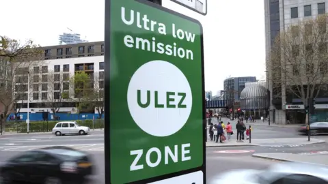 PA Media File photo showing green sign saying 'Ultra Low Emission Zone'.