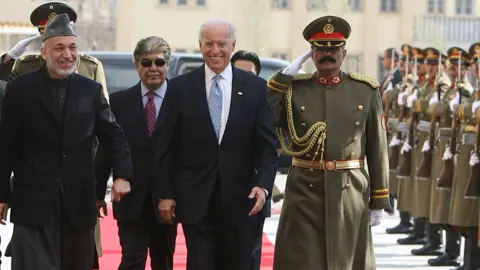 Getty Images Biden makes a surprise visit to Afghanistan as vice-president in 2011