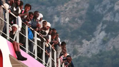 AFP/Getty Migrants arriving in the Italian port of Salerno in 2017