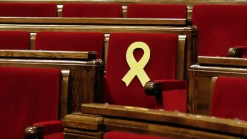 EPA Catalan parliament chair with symbol remembering those in jail