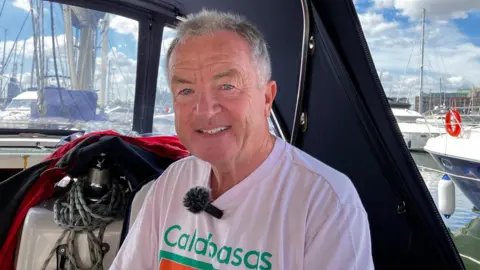 Matt Marvel/BBC Mike Harrison on his boat