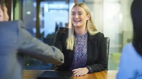 Getty Images Young woman in a job interview