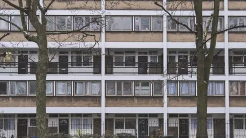 Getty Images The facade of a balconied local authority maintained residential apartment building