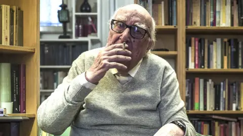 Getty Images Italian writer Andrea Camilleri poses in his house in Rome, Italy, 13 October 2017