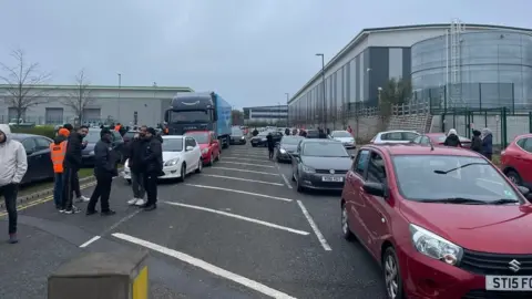 Amanda Gearing Cars at Amazon factory