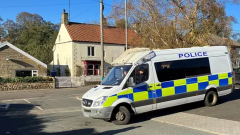 Police van in the village of Danby