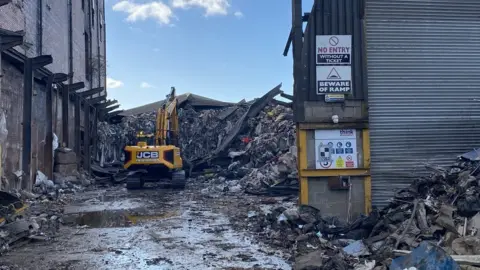 Lancashire Fire and Rescue Service Demolition work at building fire site