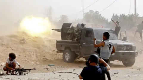 Getty Images Young men fire heavy machine guns - Saturday 25 May 2019