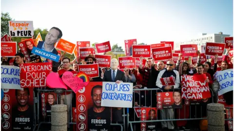 Reuters A crowd of partisan supporters await the arrival of the party leaders to the debate venue