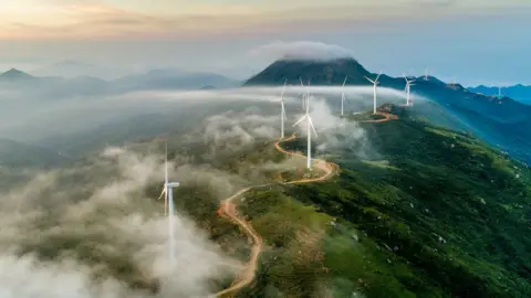 Getty Images Wind farm on mountain ridge