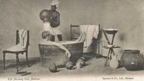 Stephen Putnam Hughes and Emily Rose Stevenson A postcard showing an Indian domestic help pouring water over a white man while he bathes in a tub.