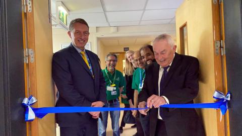Matthew Hopkins, CEO, Mid and South Essex NHS Foundation Trust, Mr Jay Menon, Abi Blake, Mr Syed Kabeer, Dr Johnson Samuel, Kevin Lafferty in the picture. Mr Lafferty is wearing a suit and cutting a blue ribbon for the new theatre