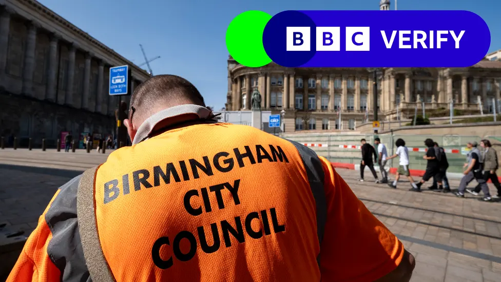 Getty Images A Birmingham City Council worker collecting refuse outside the town hall