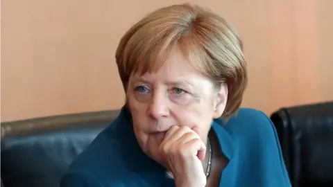 EPA German Chancellor Angela Merkel looks on at the beginning of the weekly meeting of the German cabinet