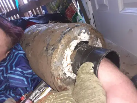 Dunsford Climate Emergency Camp Climate protestor locked onto concrete pipe