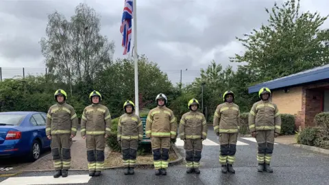 West Midlands Fire Service Firefighters in Dudley join the two minutes' silence