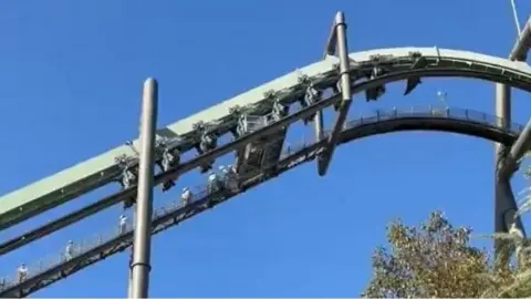 People stuck on rollercoaster