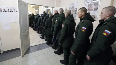 EPA Russian soldiers line up t vote in Sertolovo, outside St Petersburg, Russia, on 18 March 2018