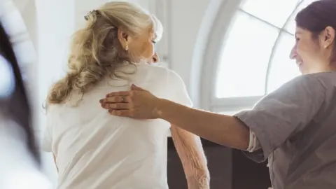 Getty Images Patient and carer