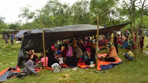 Reuters Fleeing Rohingya refugees rests under a makeshift shelter, in Bangladesh on August 27, 2017